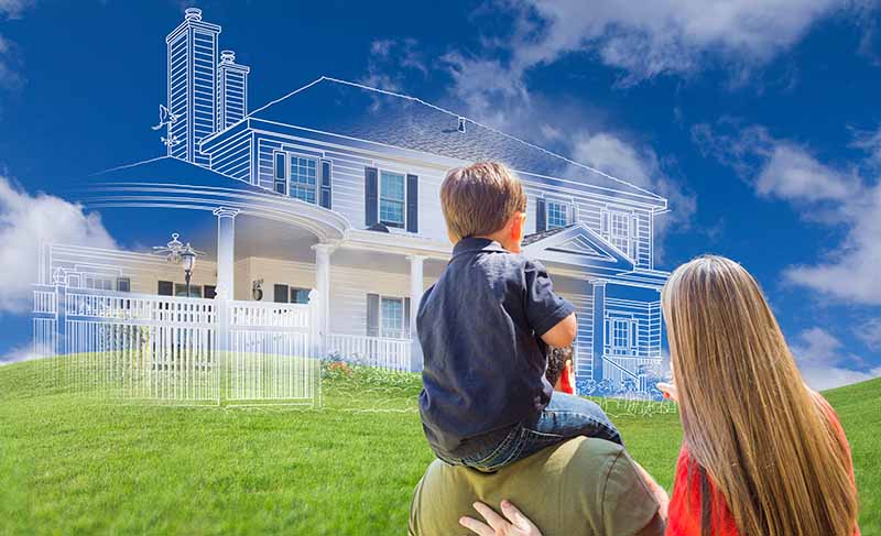 A young family imagining what their new home will look like when it has been built.